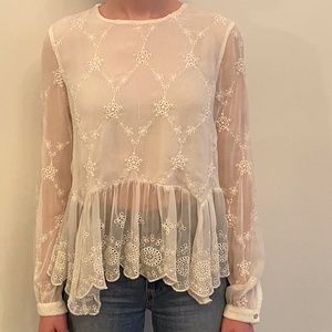 Sheer long sleeve blouse.
